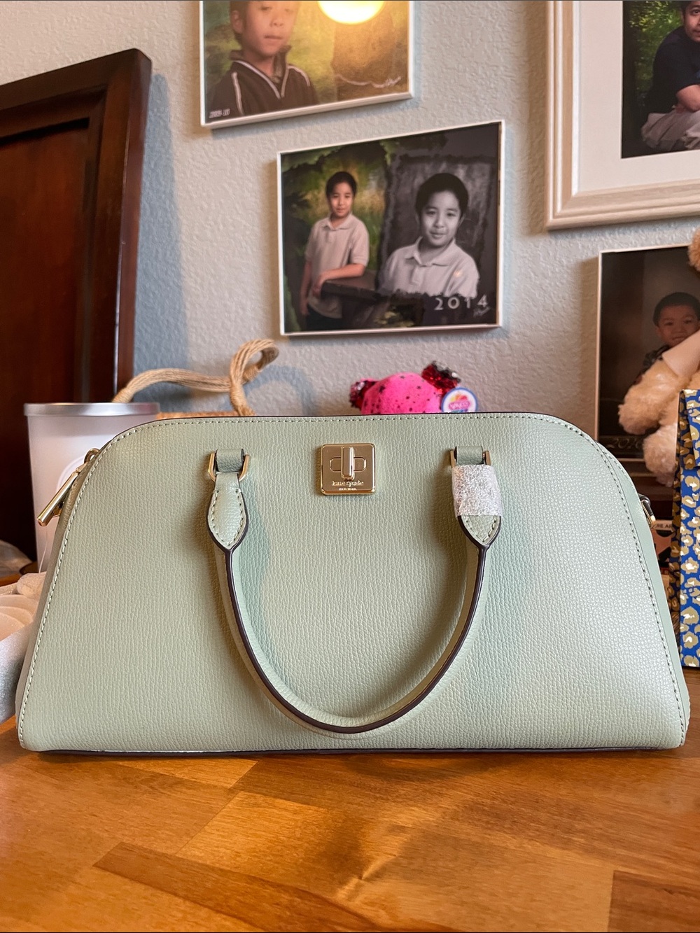 The Kate Spade KK114 refers specifically to the Phoebe East West Satchel